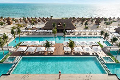 Excellence Playa Mujeres adults-only all-inclusive resort with beachfront suites and lagoon-style pools near Cancun.