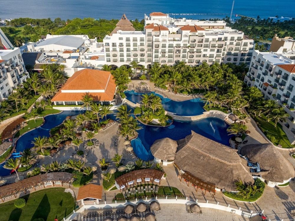 Fiesta Americana Condesa Cancun all-inclusive beachfront resort with tropical landscaping and oceanfront pools.