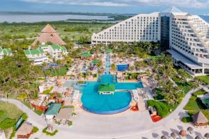 Iberostar Selection Cancun all-inclusive beachfront resort with ocean-view pools and nearby golf course.