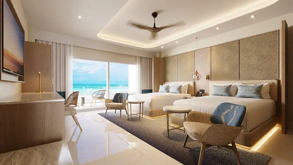 Ocean Front Junior Suite Double with two queen beds and private terrace overlooking the Caribbean Sea at Hyatt Zilara Cancun.