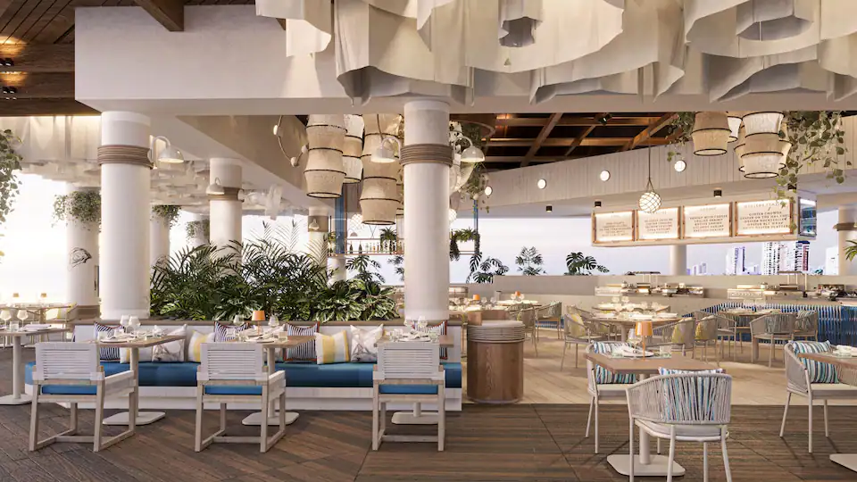 Pier 12 restaurant at Hyatt Zilara Cancun featuring oceanfront seafood dining, modern coastal décor, and panoramic Caribbean views.